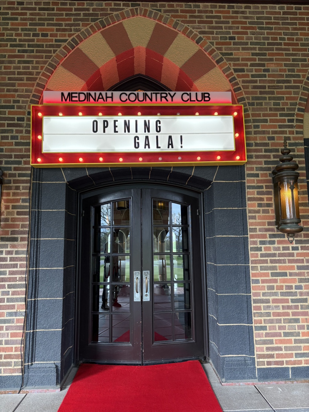 Illuminated theater-style marquee reading “Opening Gala!” at Medinah Country Club